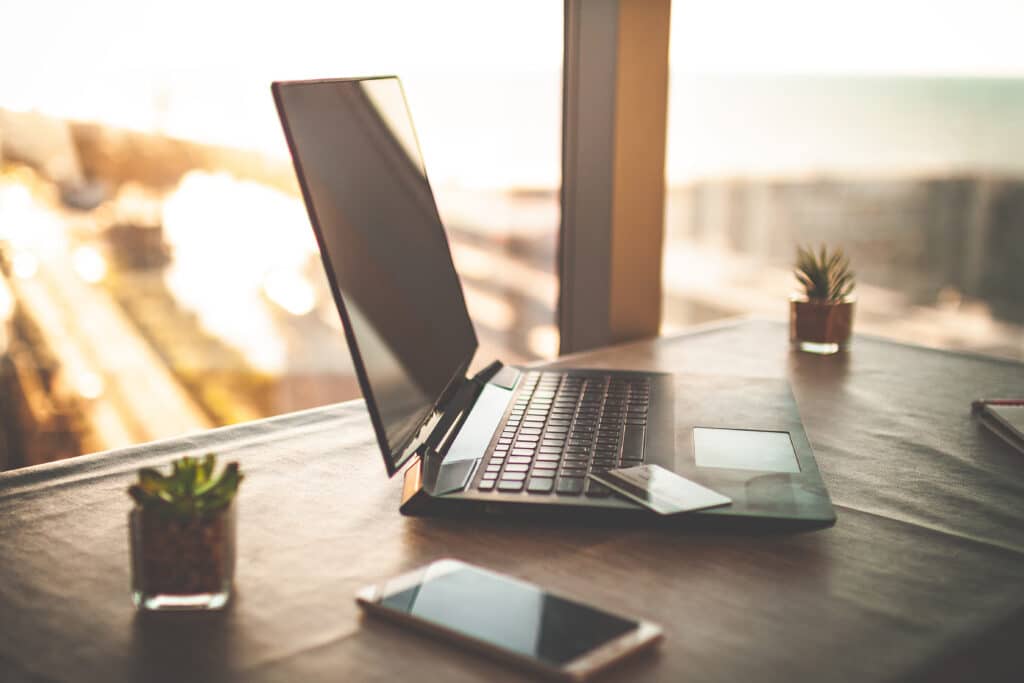 laptop placed on a working desk