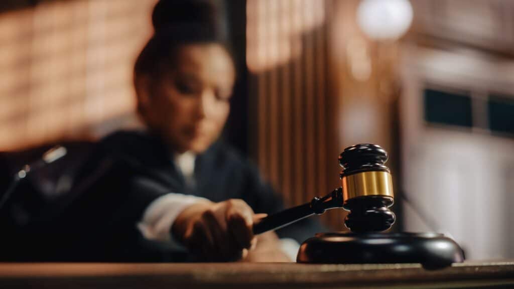 Magistrate taping the gavel in the court