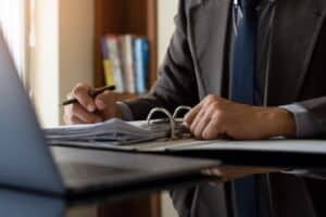 Lawyer going through documents in the folder