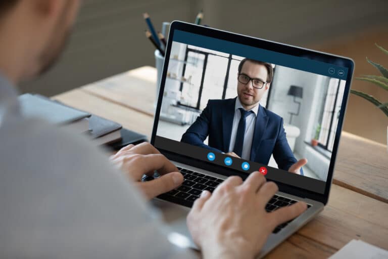 Remote lawyer on a video call with hiring attorney